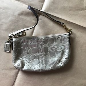 Coach gold wristlet/clutch.